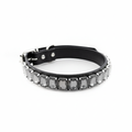 Grey rhinestone dog collar displayed against a soft lavender studio background.