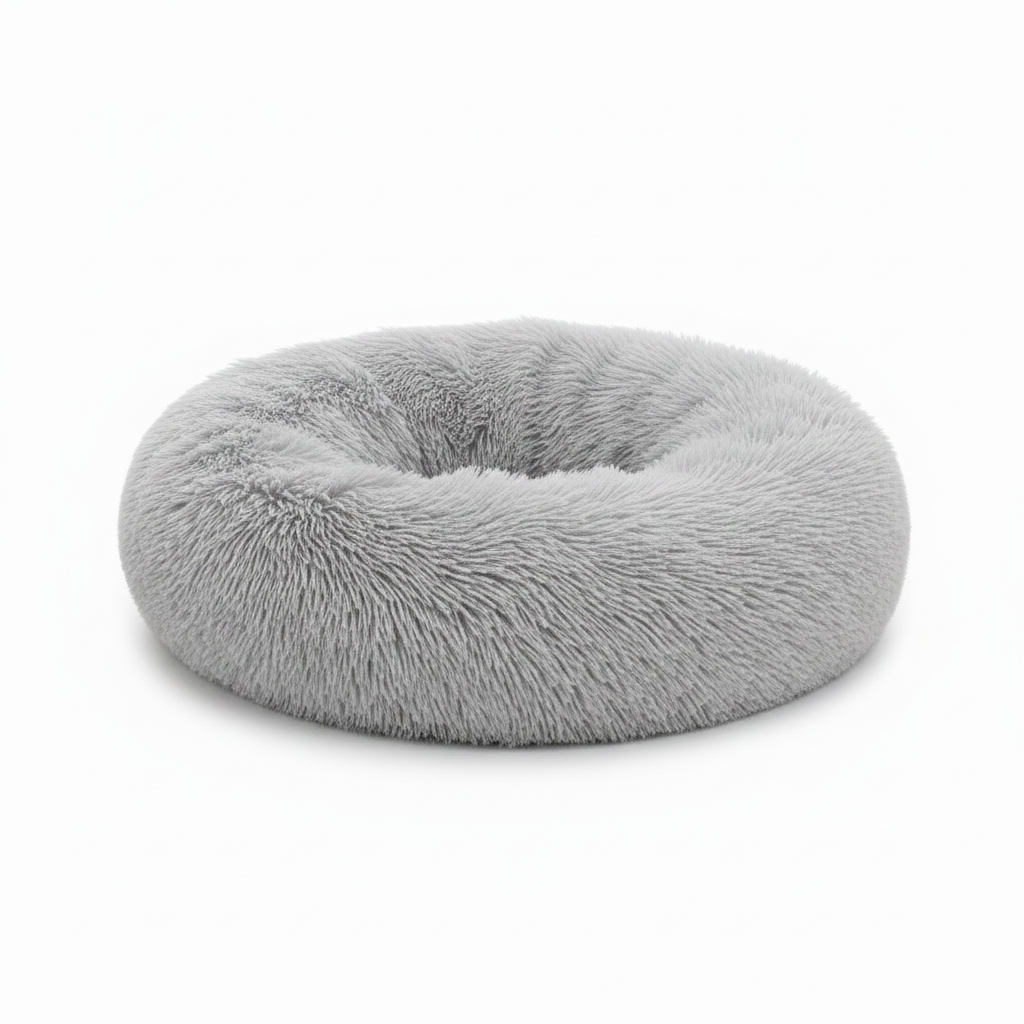 Light grey round donut pet bed with long shaggy faux fur and a deep cushioned center, shown on a white background