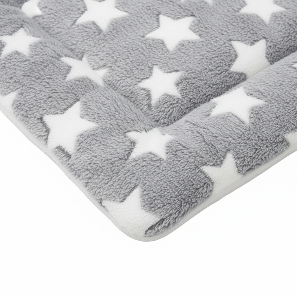 Close-up texture detail of grey plush star print pet mat showing soft sherpa lining on white background