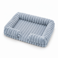 Ice blue ribbed corduroy rectangular pet sofa bed with raised bolster sides, shown at a 3/4 angle on a white background