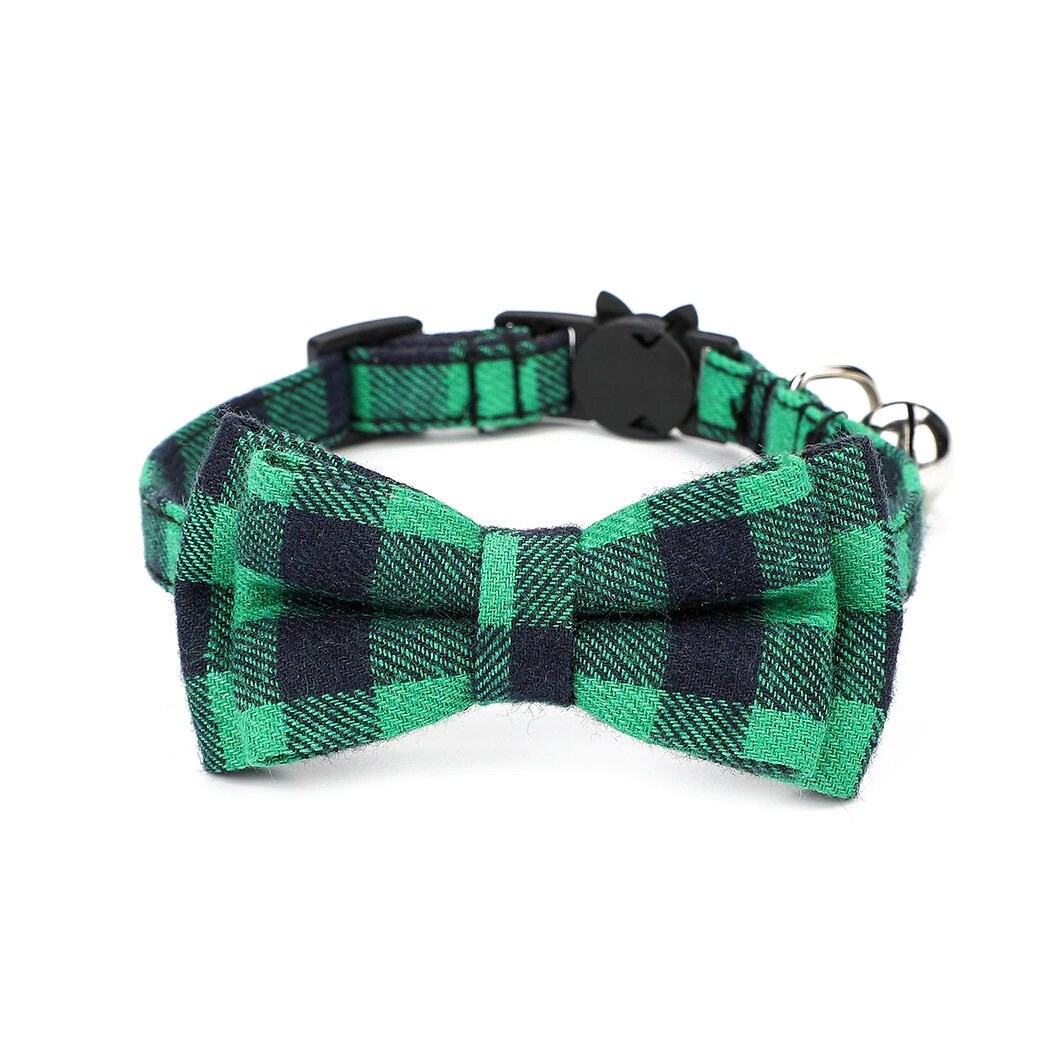 Green and black checkered cat collar with bow tie on a white background
