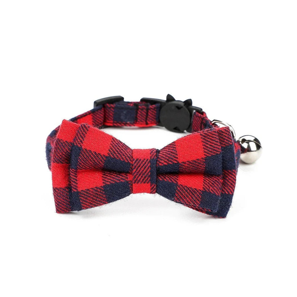 Red and blue plaid bow tie cat collar with a bell on a white background