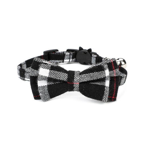 Black and white plaid bow tie cat collar with a bell on a white background