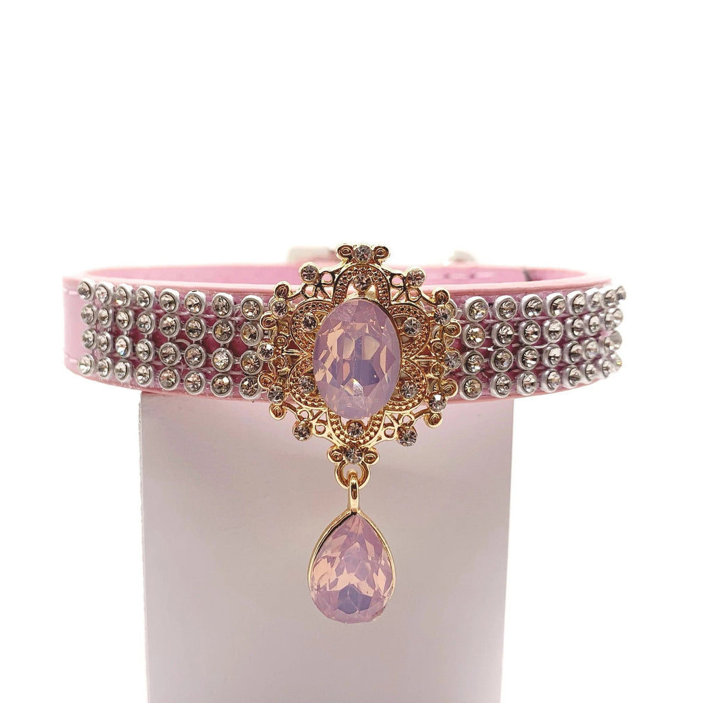 Pink velvet luxury dog collar with triple-row crystal rhinestone band, gold baroque filigree rose quartz centerpiece, and dangling pink teardrop gem