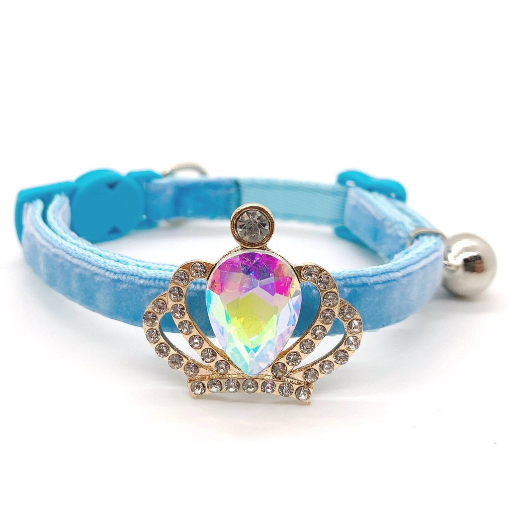 Baby blue velvet cat collar with gold crown aurora borealis iridescent crystal centerpiece, rhinestone halo setting, and silver bell