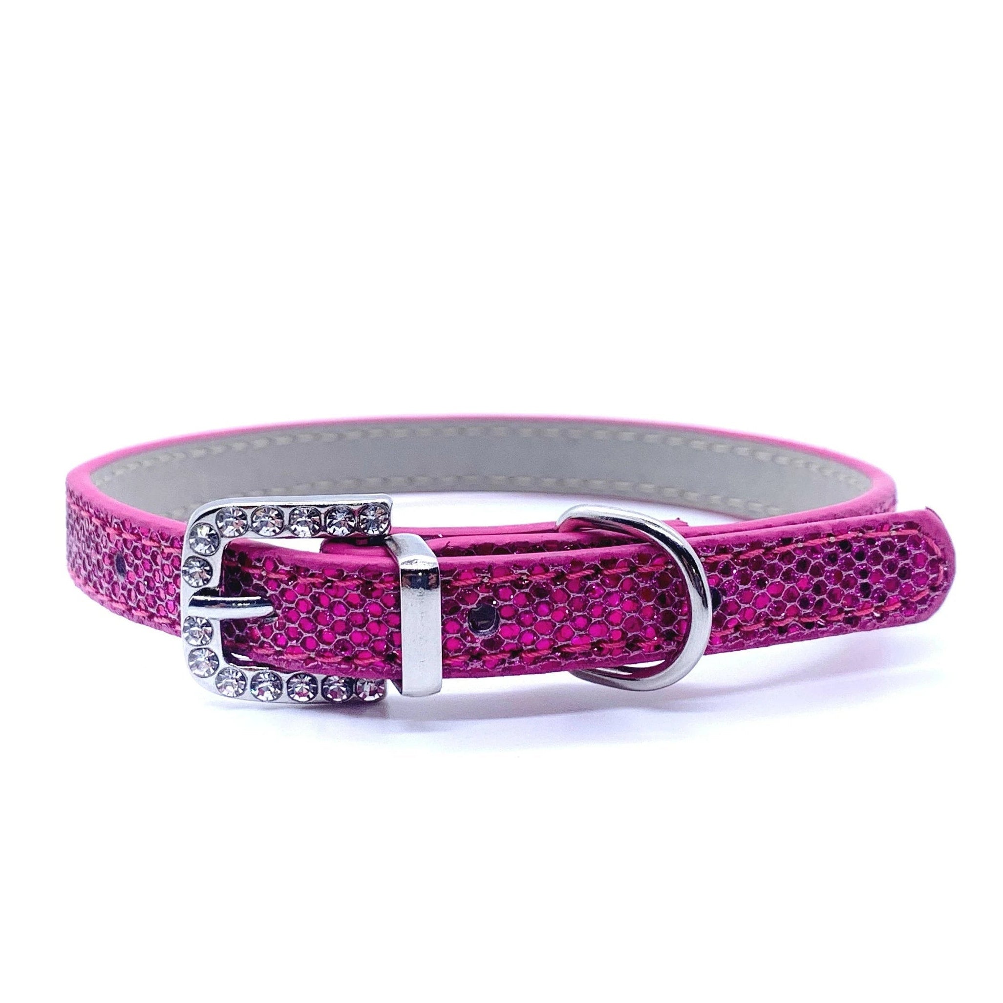 Pink glittery cat collar with a silver buckle on a white background