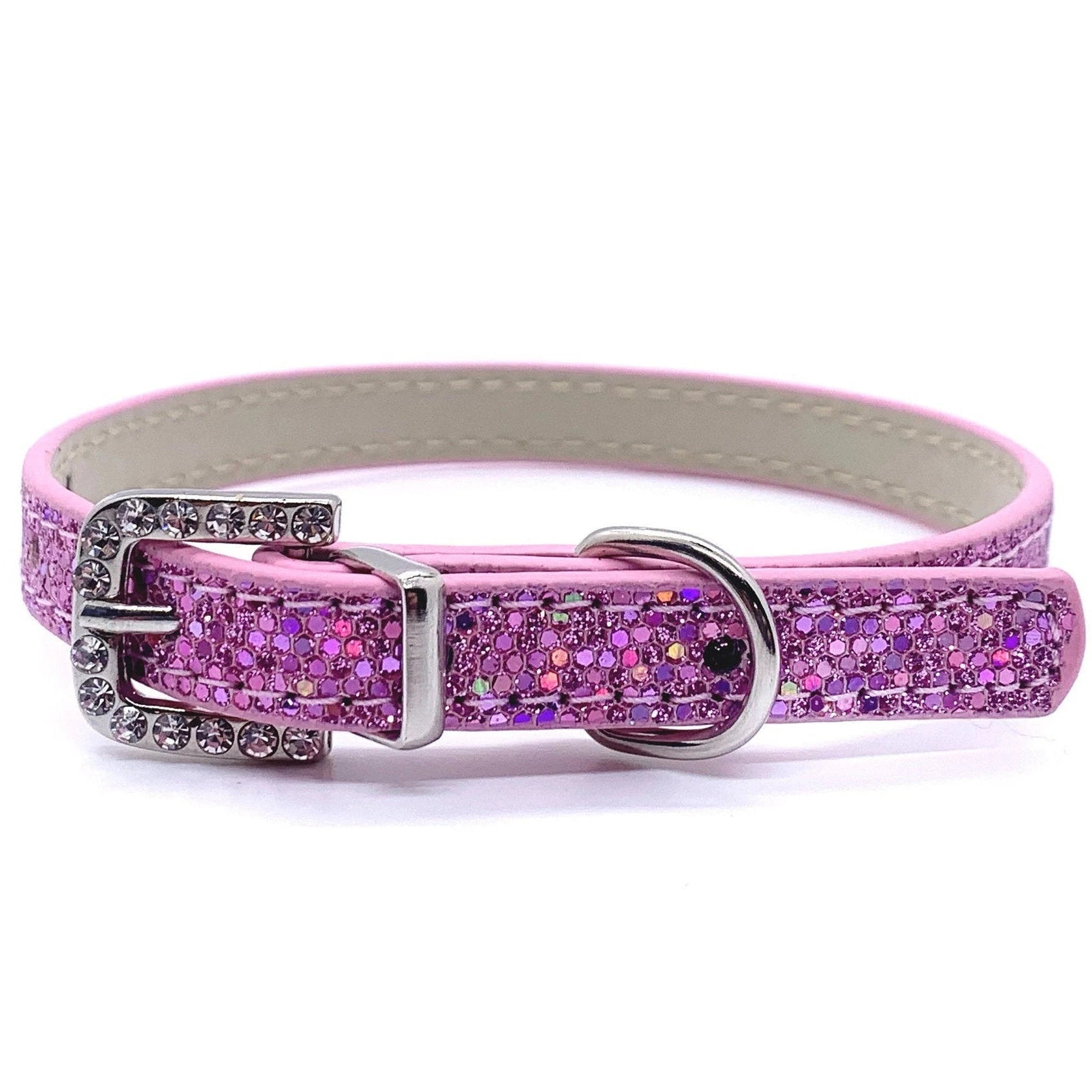 Pink glittery dog collar with silver buckle on a white background