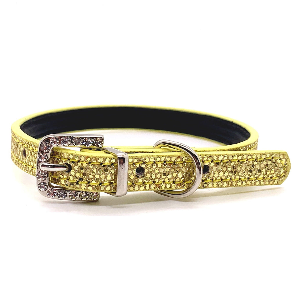 Yellow dog collar with rhinestone details on a white background