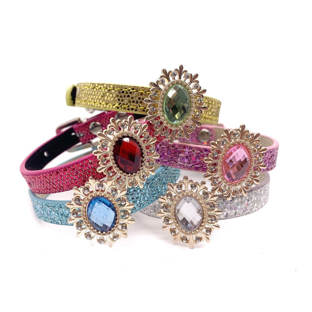 Set of colorful dog collars with decorative elements on a white background