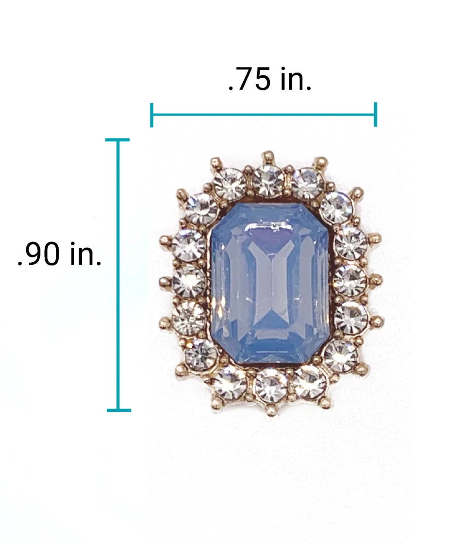 Close-up of 0.75 x 0.90 inch sapphire blue emerald-cut rhinestone charm with crystal halo setting for luxury pet collar