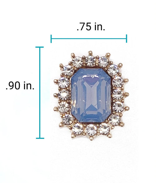 Close-up of 0.75 x 0.90 inch sapphire blue emerald-cut rhinestone charm with crystal halo setting for luxury pet collar