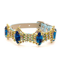 Baby blue glitter pet collar with full-band sapphire blue marquise crystals and aurora borealis AB rhinestone accents in gold settings side angle view for cats and dogs