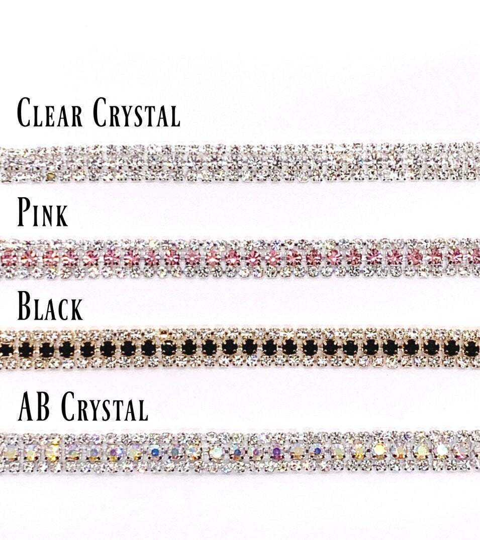 Four types of decorative ribbons with clear crystal, pink, black, and AB crystal patterns on a white background.