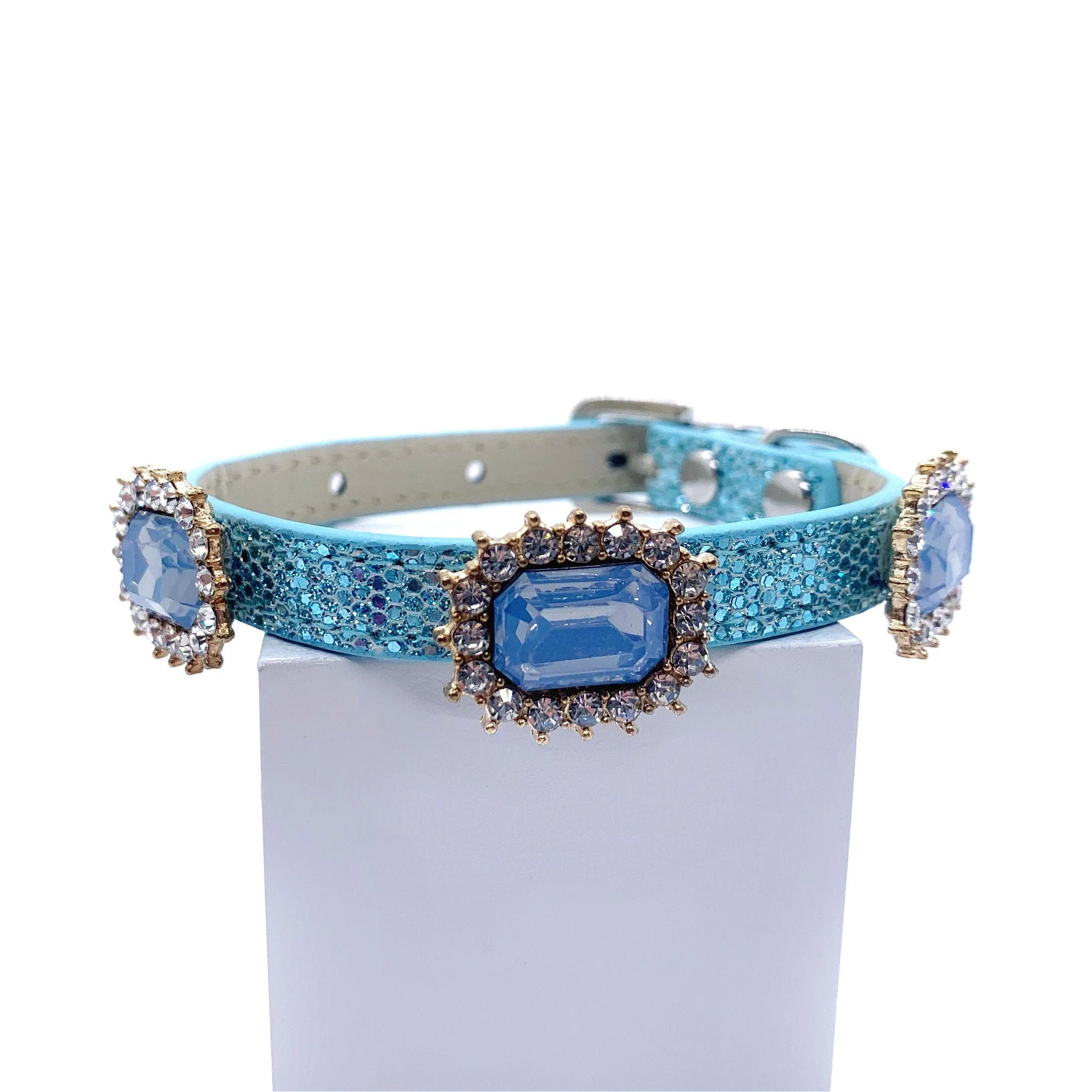 Blue decorative pet collar with gemstones on a white background