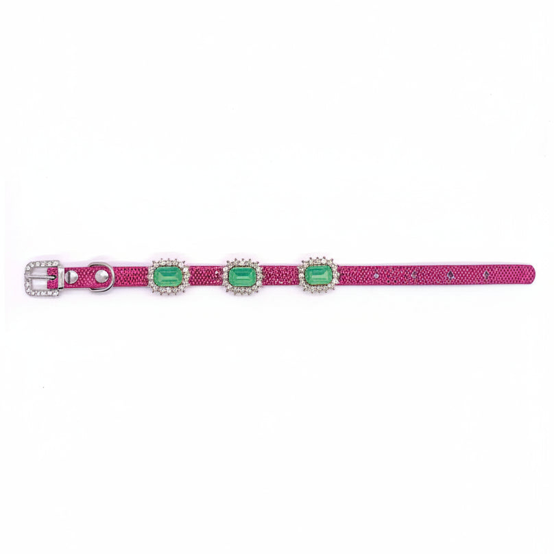 Pink glitter pet collar with green gemstones and a silver buckle on a white background for cats and dogs