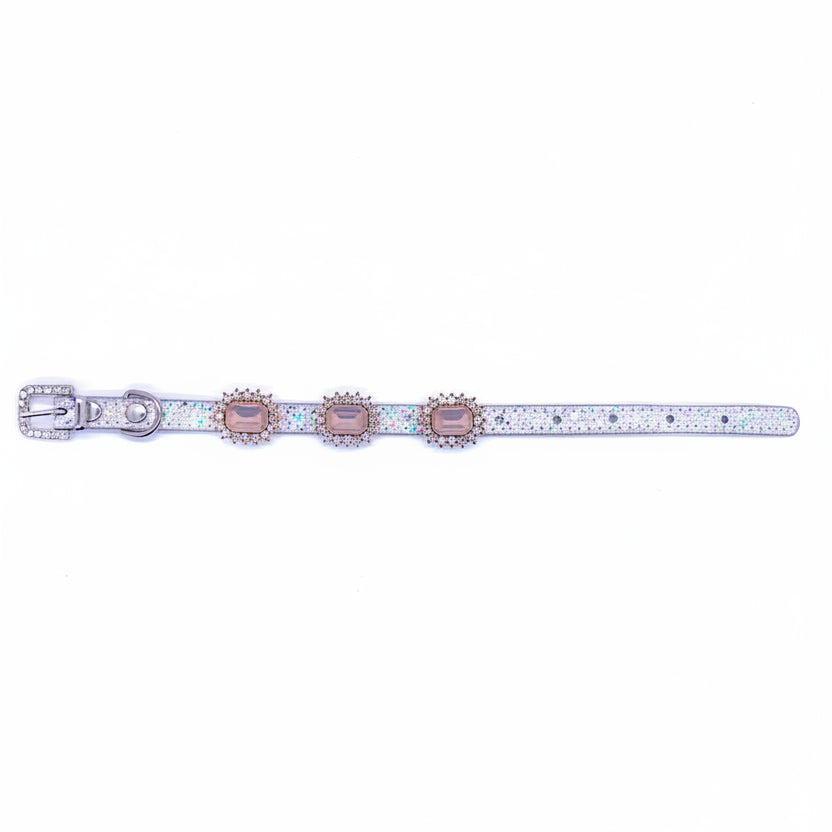 Silver iridescent glitter pet collar with three rose champagne emerald-cut crystal charms in rhinestone halo settings laid flat showing full length with rhinestone-encrusted buckle for cats and dogs
