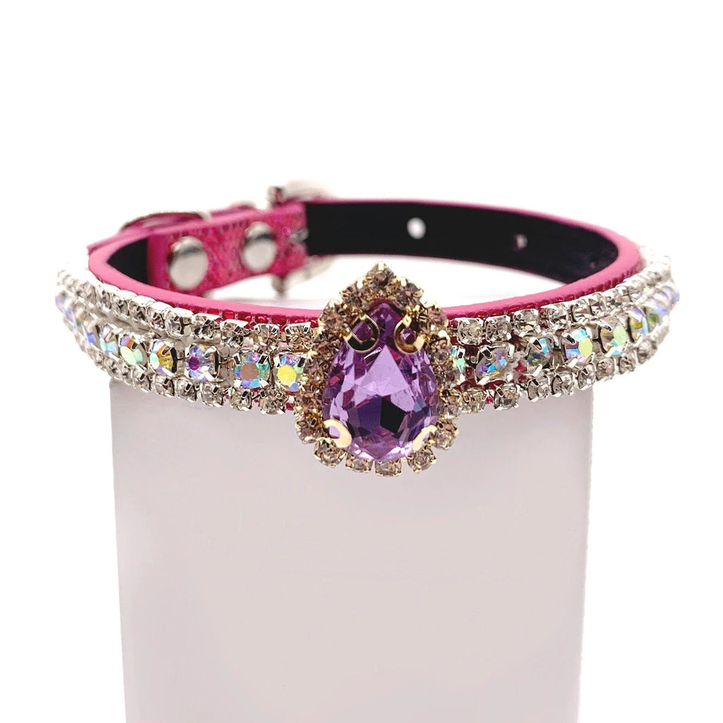 Pink dog collar with aurora borealis crystal rhinestone band and amethyst purple teardrop centerpiece charm for cats and dogs on a white background