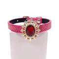 Hot pink metallic honeycomb texture pet collar with gold sunflower brooch centerpiece, ruby red oval crystal gemstone, and rhinestone petal accents for cats and dogs