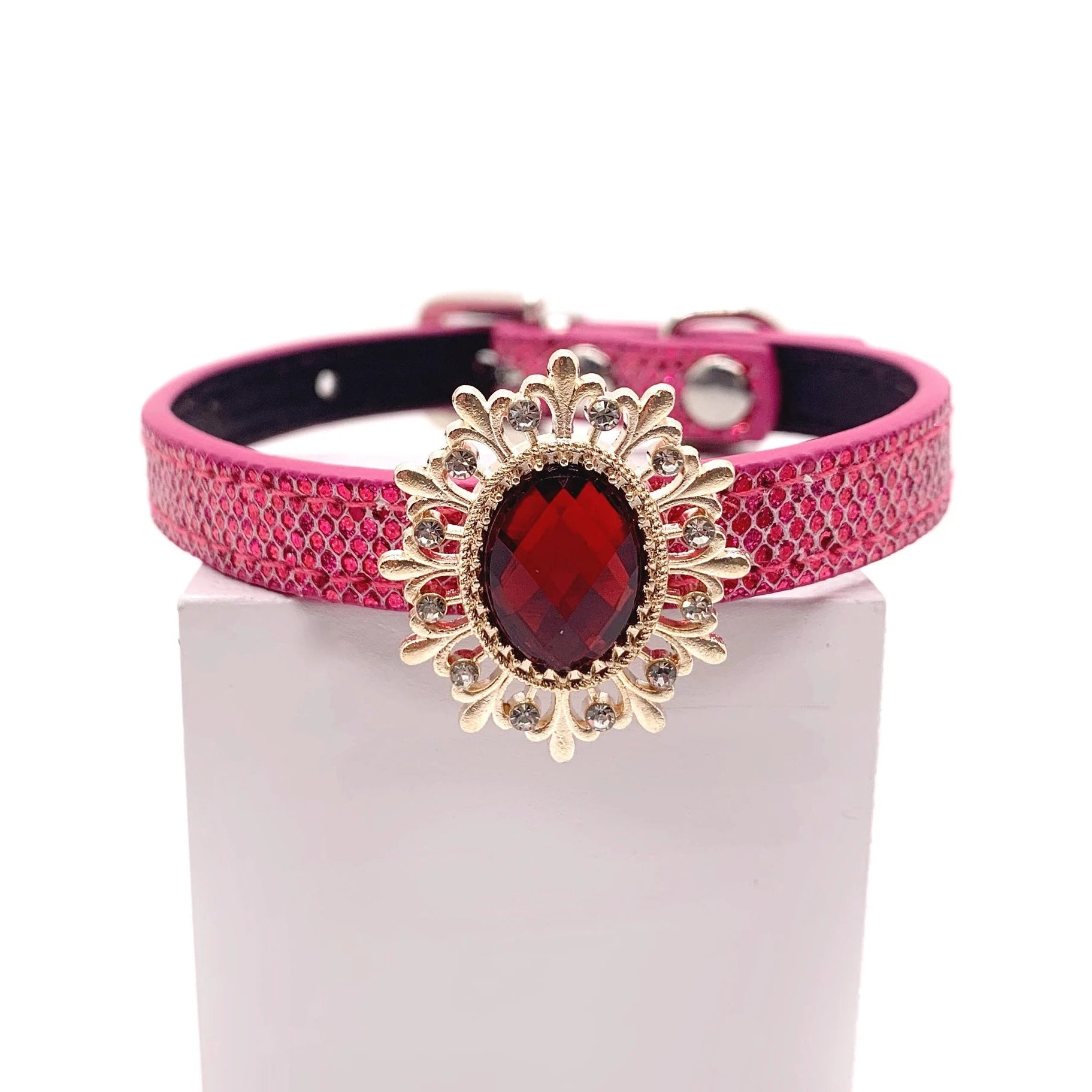 Hot pink metallic honeycomb texture pet collar with gold sunflower brooch centerpiece, ruby red oval crystal gemstone, and rhinestone petal accents for cats and dogs