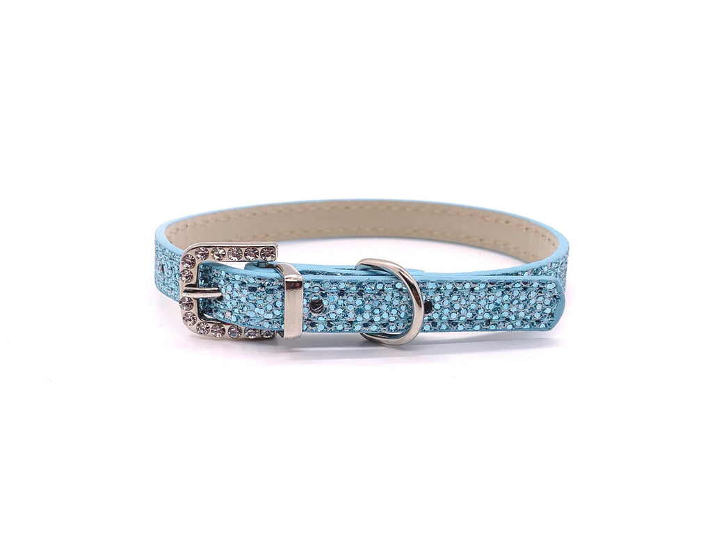 Blue glittery dog collar with a silver buckle on a white background