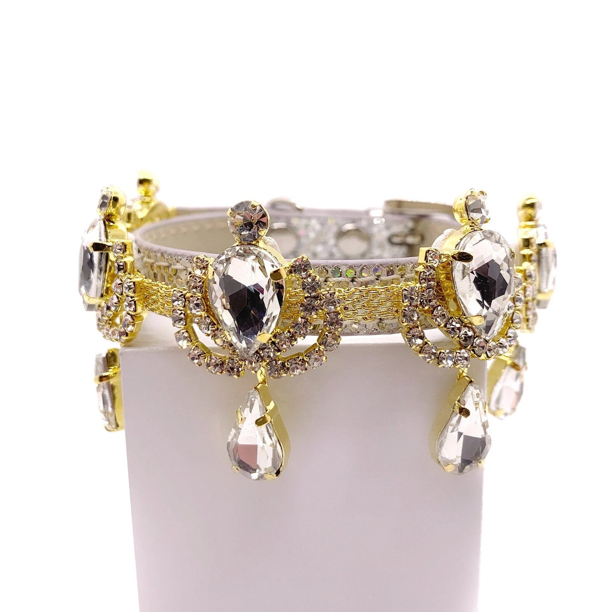 Silver leather luxury dog collar with gold chandelier rhinestone band, large faceted clear crystal teardrop centerpieces, and dangling crystal teardrop pendants