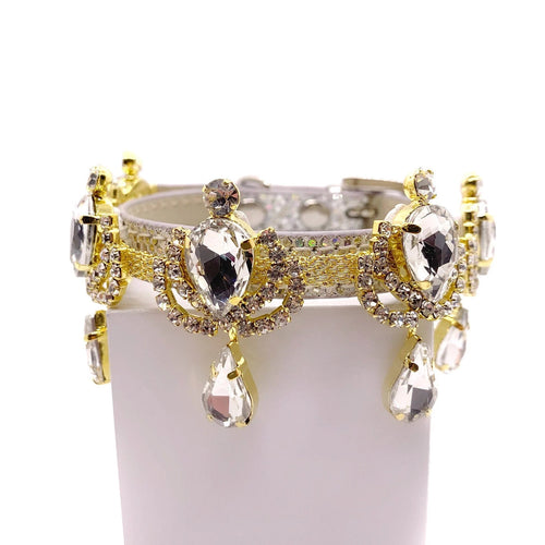 Silver leather luxury dog collar with gold chandelier rhinestone band, large faceted clear crystal teardrop centerpieces, and dangling crystal teardrop pendants
