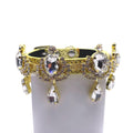 Gold leather luxury dog collar with gold chandelier rhinestone band, large faceted clear crystal teardrop centerpieces, swag rhinestone drape, and dangling crystal teardrop pendants