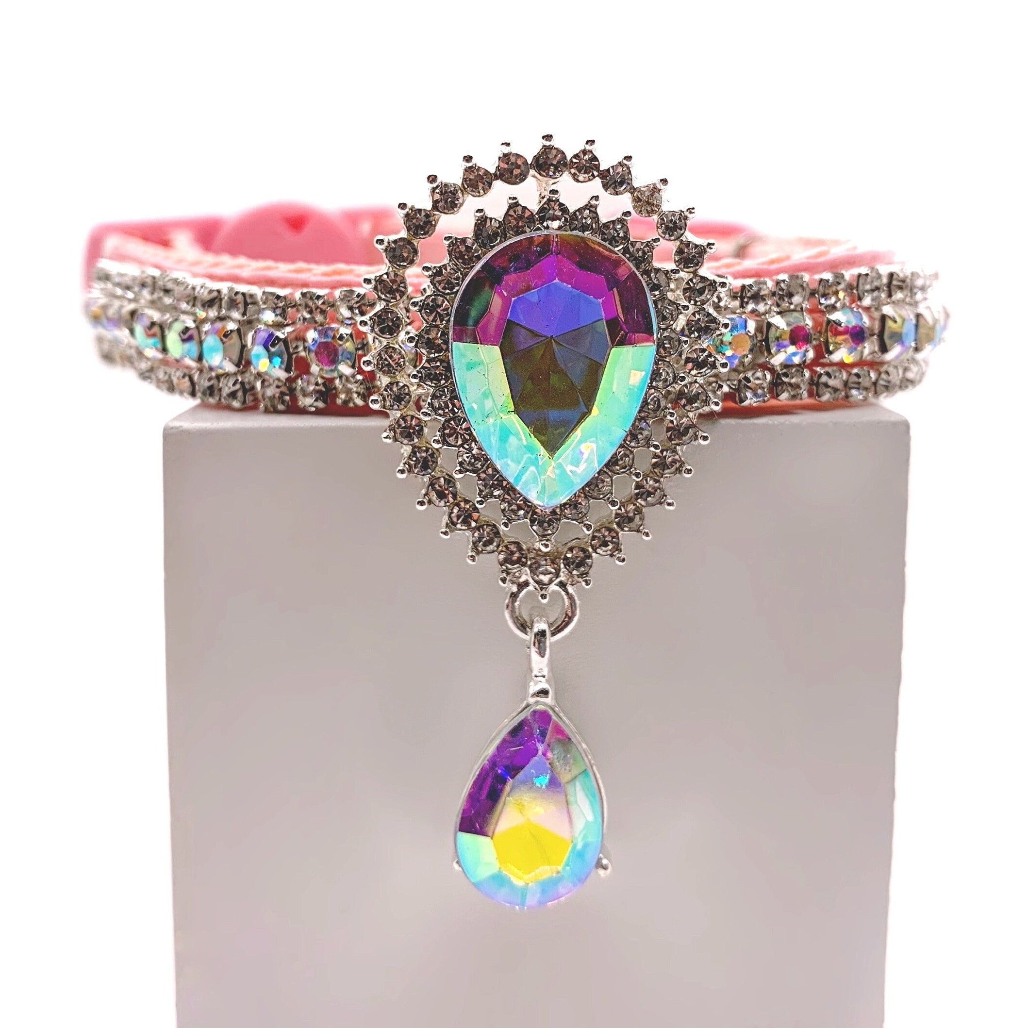 Pink velvet pet collar with double-row crystal rhinestone band, aurora borealis iridescent teardrop centerpiece brooch, and dangling AB crystal teardrop charm for cats and dogs