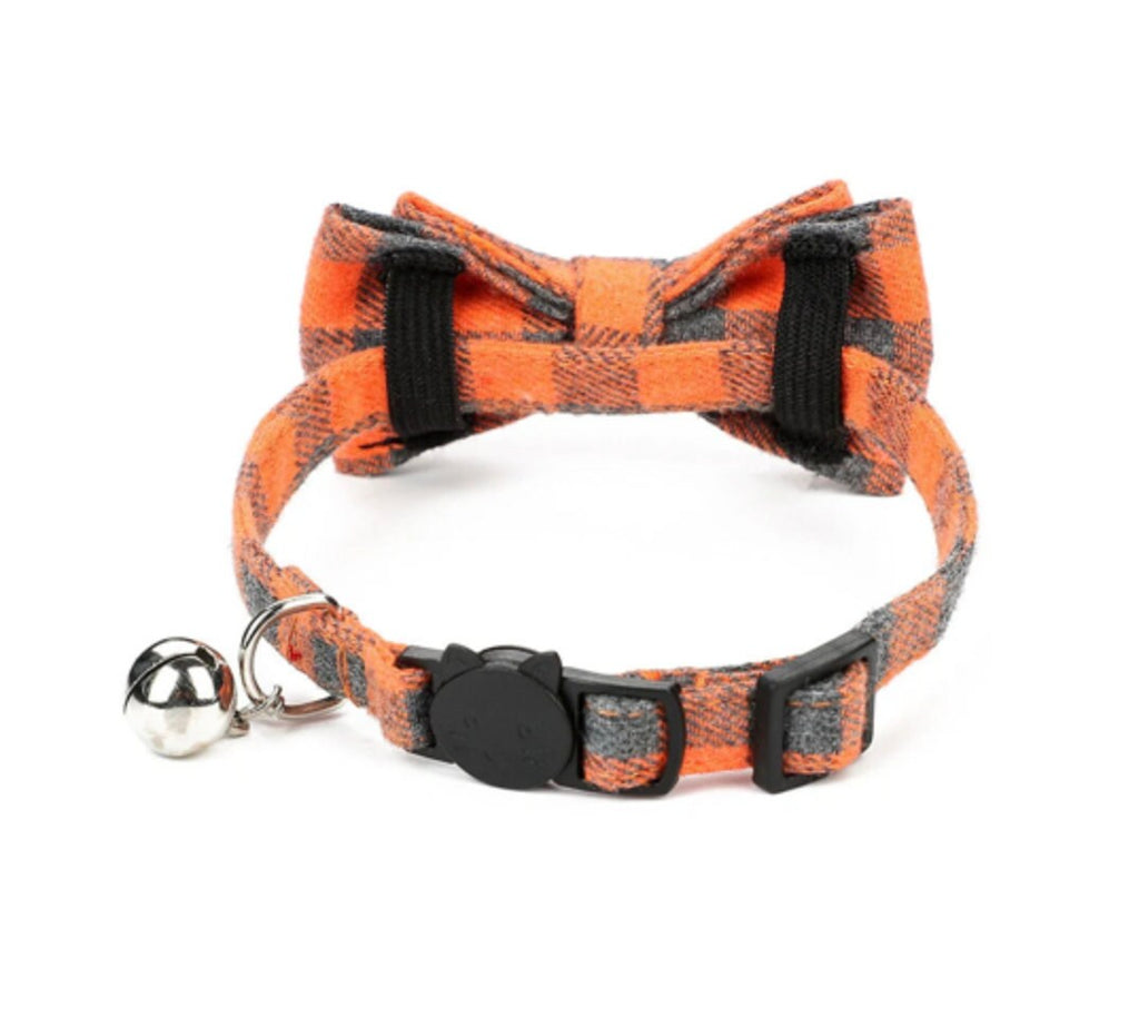 Orange and black buffalo plaid cat collar with bow tie and silver bell safety breakaway buckle