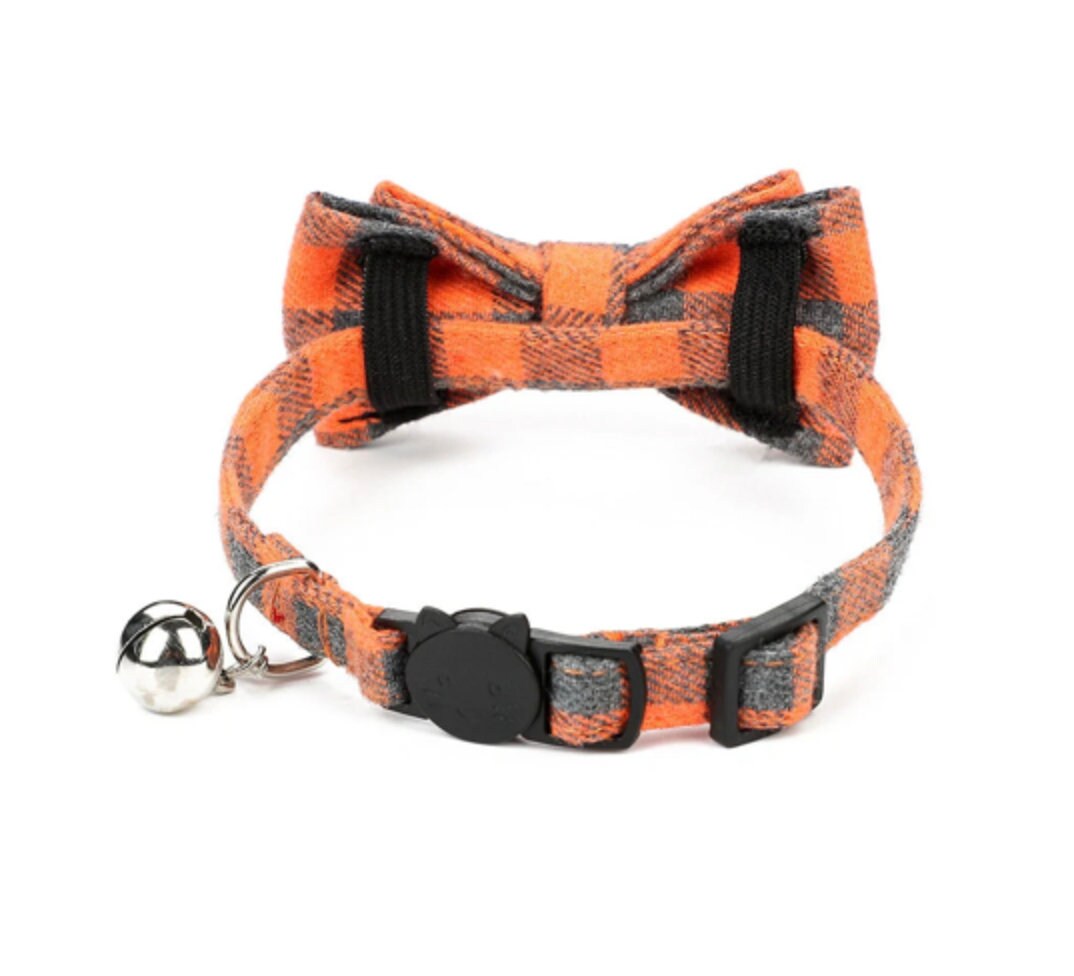 Orange and black buffalo plaid cat collar with bow tie and silver bell safety breakaway buckle