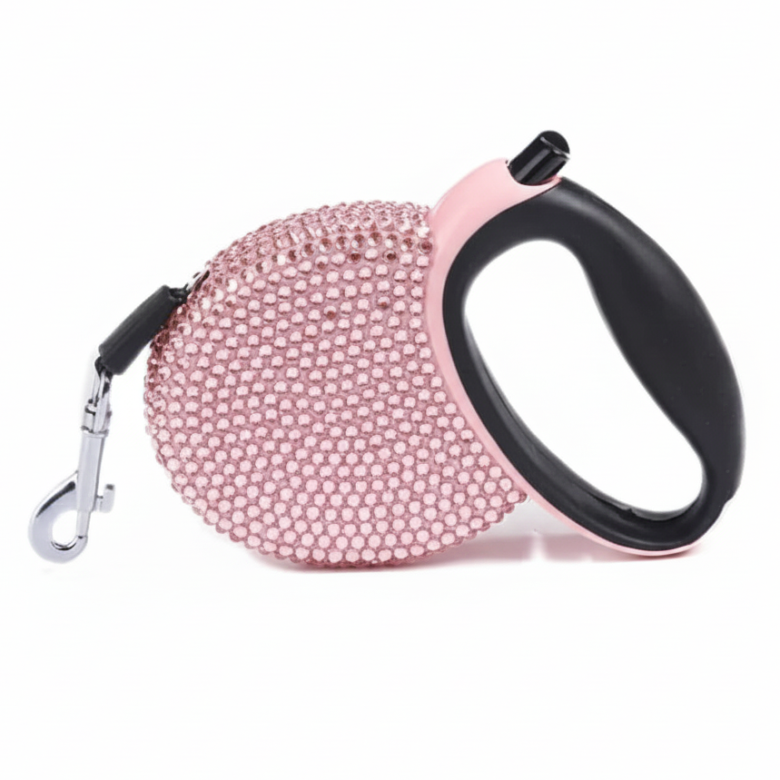 Soft pink rhinestone-studded retractable dog leash on a white background