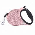 Soft pink rhinestone-studded retractable dog leash on a white background