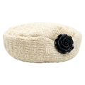 Ivory beret with black rose on a pure white background