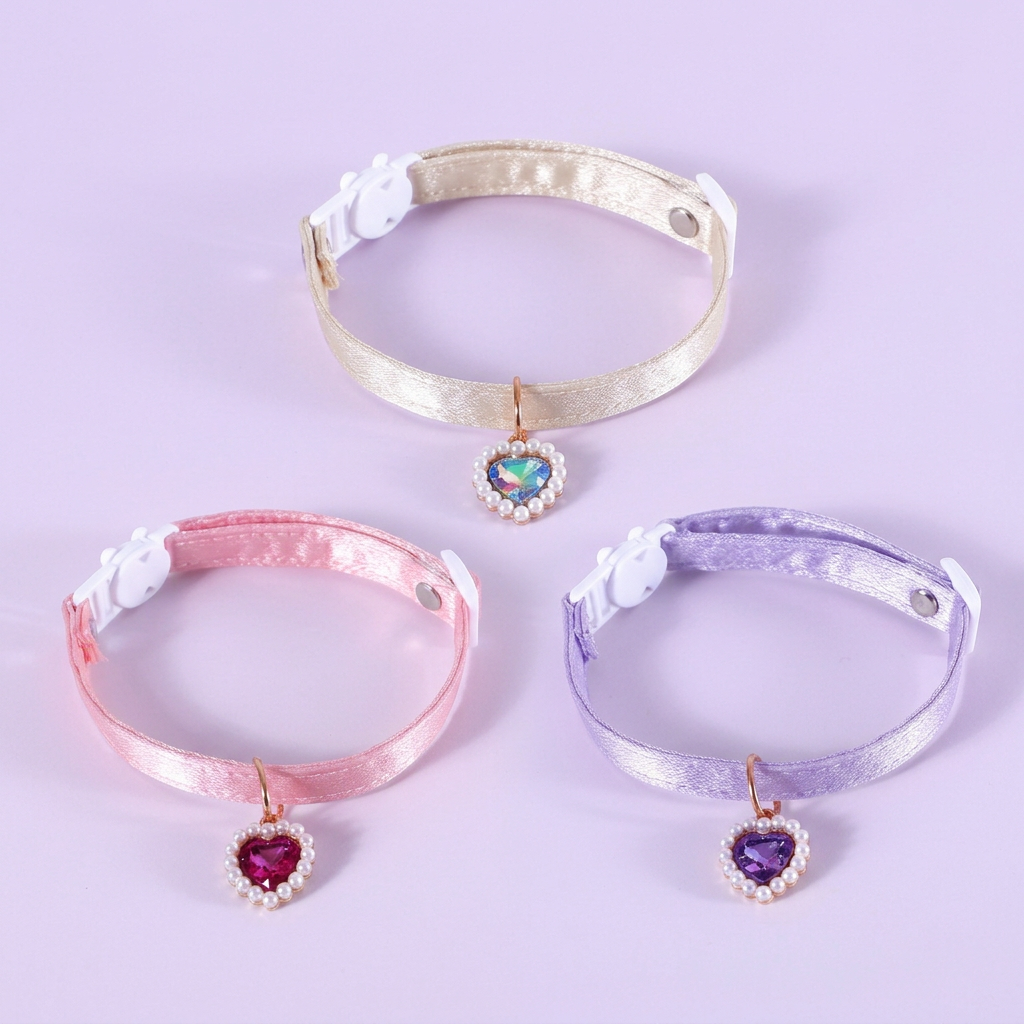 Ivory, pink, and lavender heart-pendant collars together on a light lavender background