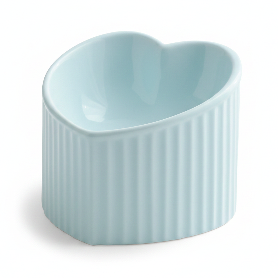 Light blue ceramic heart-shaped pet bowl with ribbed exterior, white background
