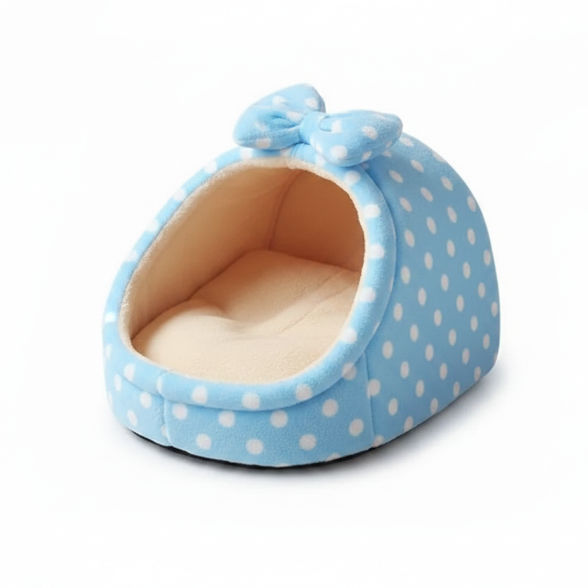 Light blue white polka dot igloo cat cave bed with matching bow detail and cream fleece interior, white background