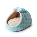 Mint teal plush igloo cat cave bed with multicolor floral print, matching bow detail, and cream fleece interior, white background