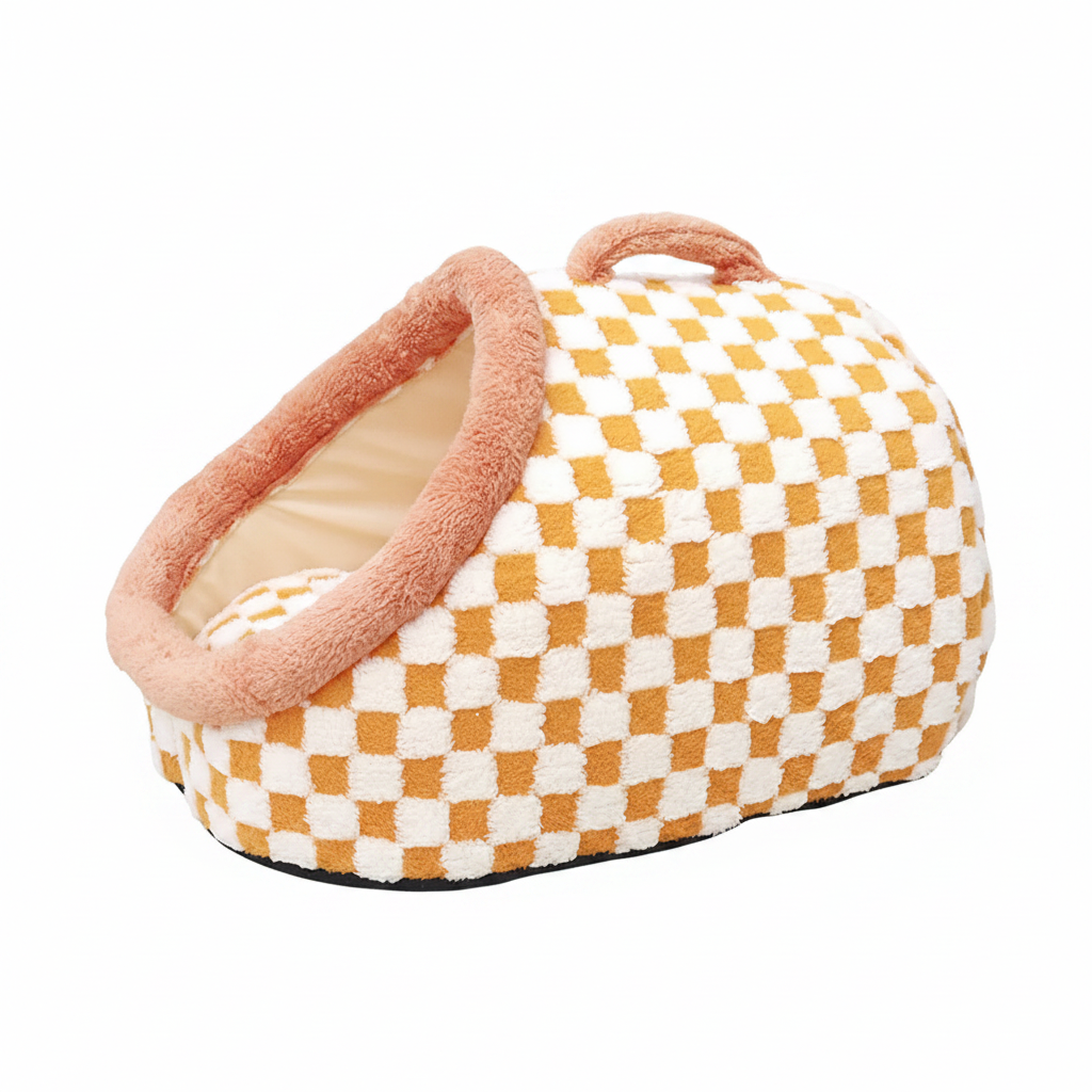 Mustard yellow and white checkerboard plush pet igloo cave bed with blush pink padded dome entrance and handbag-style carry handle on white background
