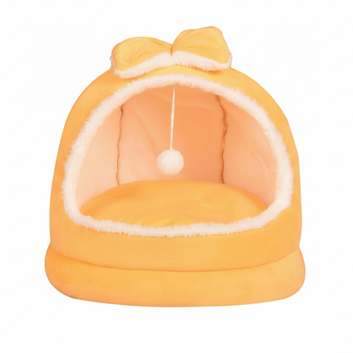 Yellow plush dome cat bed with matching orange bow on top, hanging white pom pom ball, cream fluffy interior lining, on a clean white background