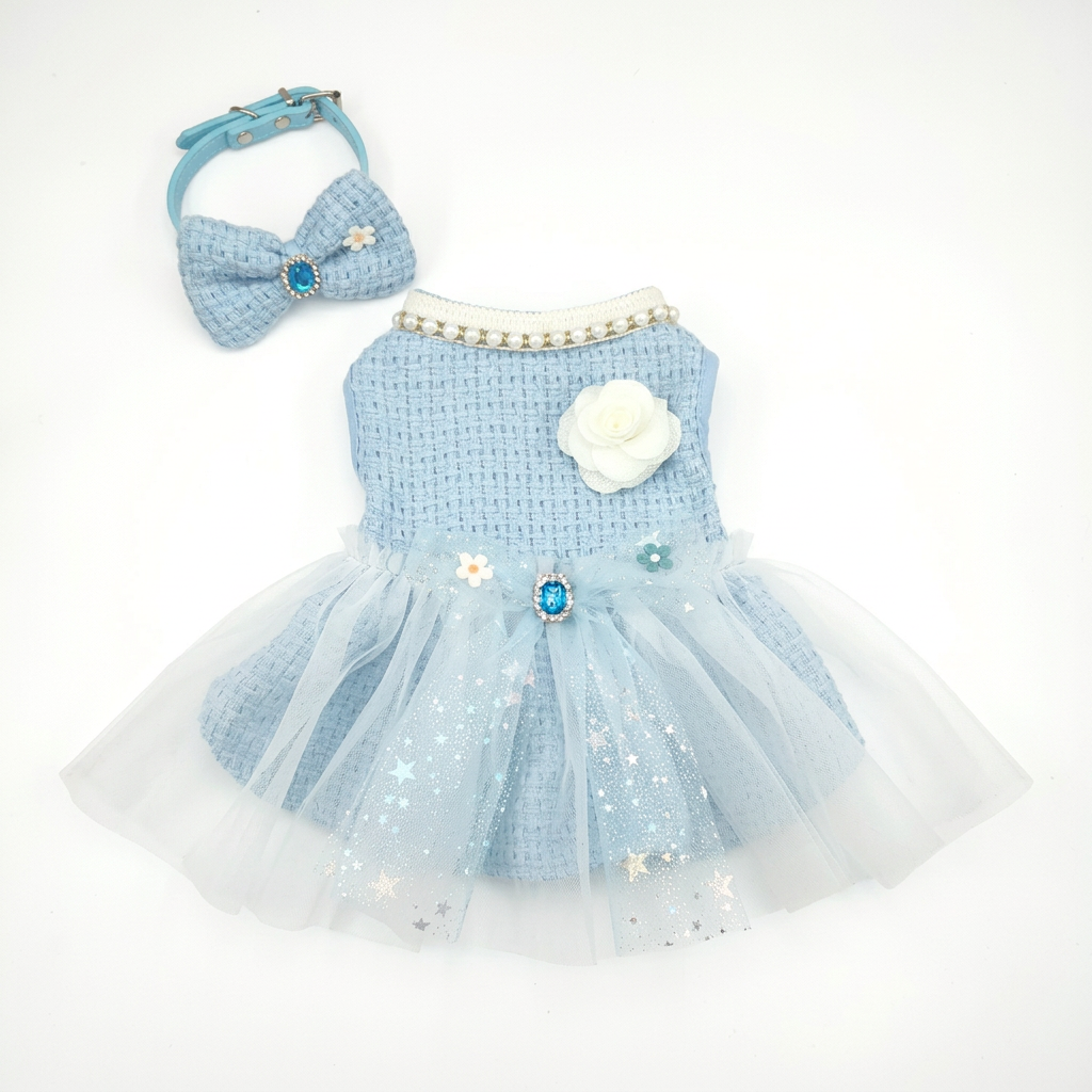 Pale blue pet dress and matching bow accessory on a white background