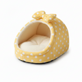 Pale yellow white polka dot igloo cat cave bed with matching bow detail and cream fleece interior, white background