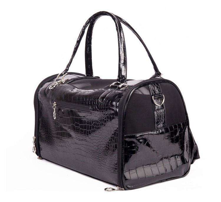 A glossy black pet carrier with an embossed crocodile pattern, featuring dual top handles, silver-tone hardware, and a zippered front pocket, shown against a plain white background.