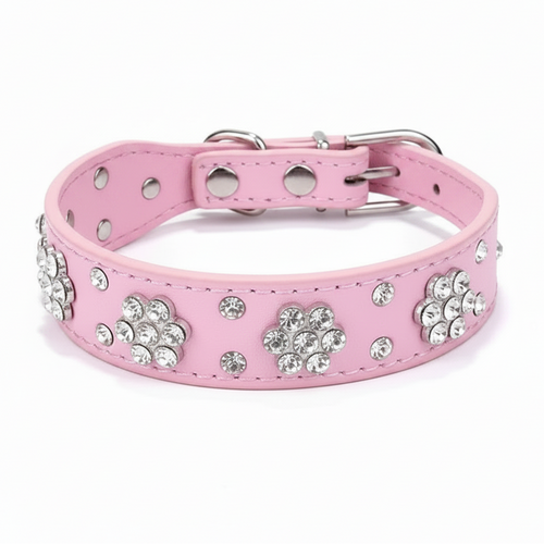 Pink jeweled pet collar with a bright pink interior, displayed against a soft lavender studio background.