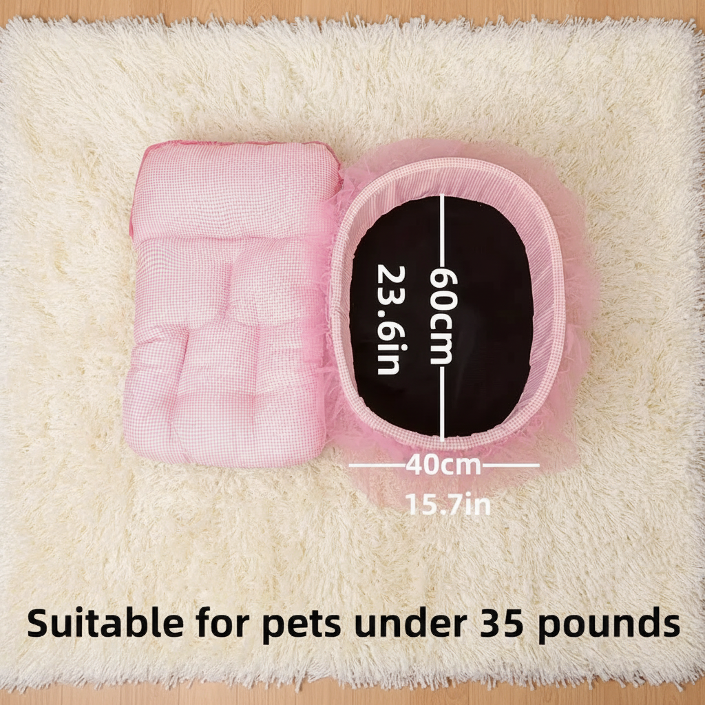 Top-down size guide of pink gingham oval pet bed showing dimensions 60cm x 40cm (23.6in x 15.7in) with non-slip base visible, displayed on a white fluffy rug, suitable for pets under 35 pounds