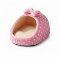 Pink white polka dot igloo cat cave bed with matching bow detail and cream fleece interior, white background
