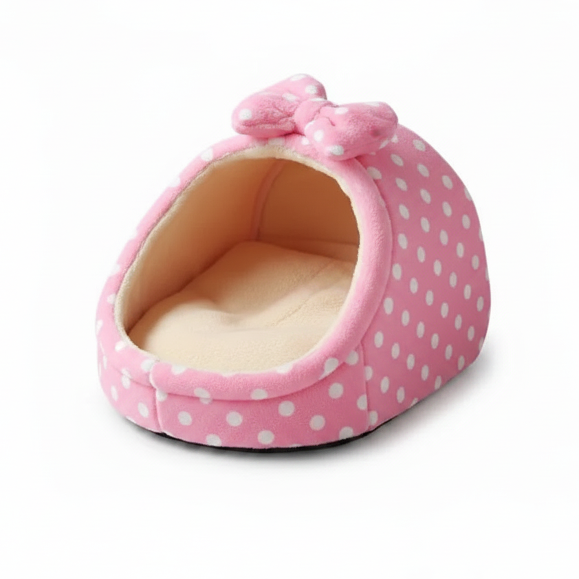 Pink white polka dot igloo cat cave bed with matching bow detail and cream fleece interior, white background