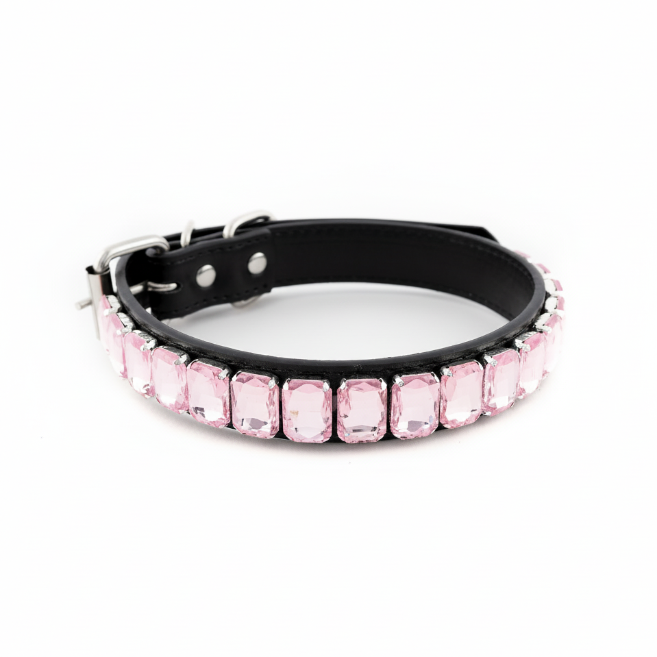 Black pet collar featuring a row of pale pink rectangular rhinestones on a white background.