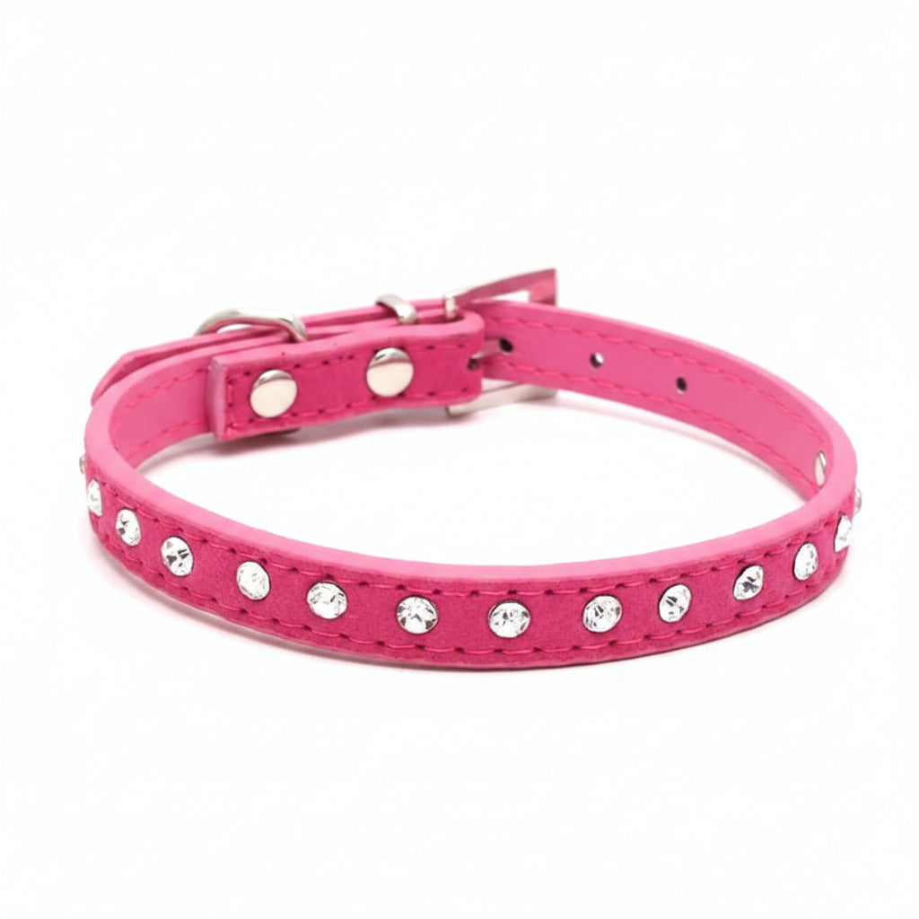 Hot pink leather cat and dog collar with single row clear rhinestone crystals and silver buckle, angled side view luxury bling pet collar product photo on white background
