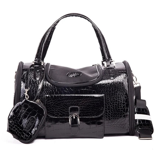 Black crocodile-patterned pet carrier with matching pouch on a white background