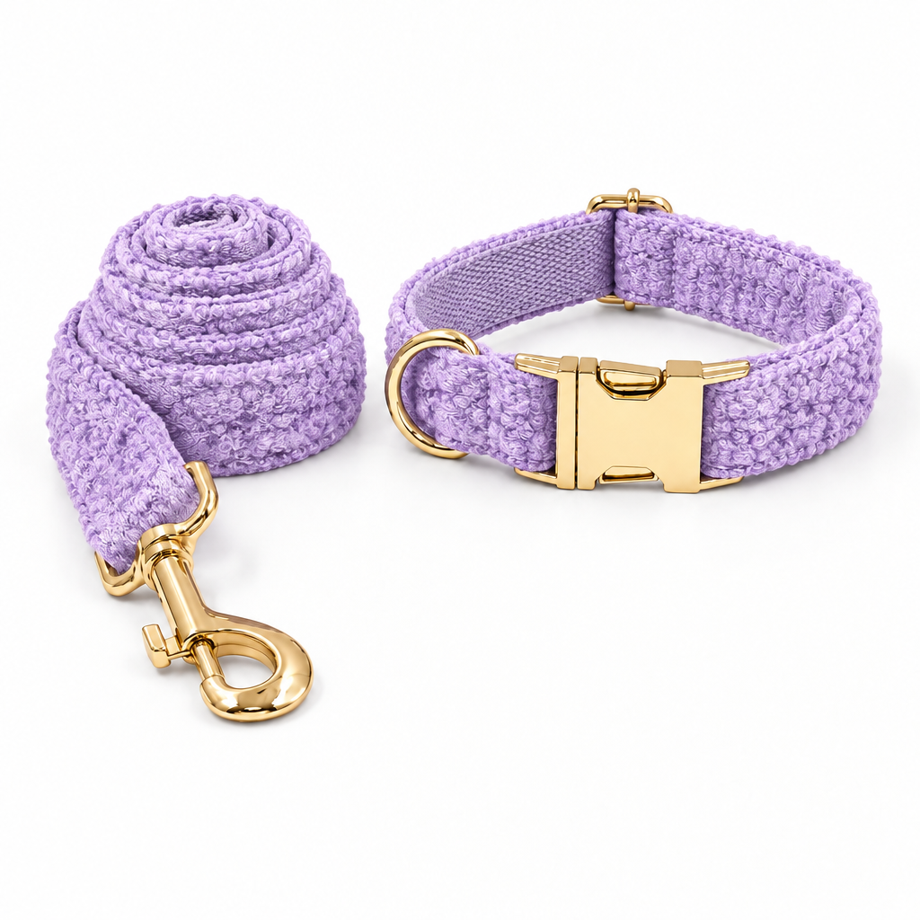 Purple teddy fleece collar and leash set arranged with the leash on the left and collar on the right